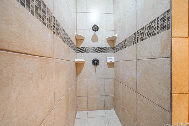 bathroom with a tile shower