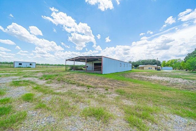 view of outbuilding featuring a rural view