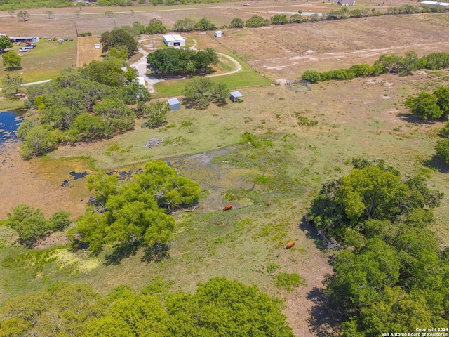 birds eye view of property with a rural view