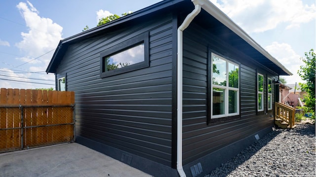 view of side of property featuring a patio