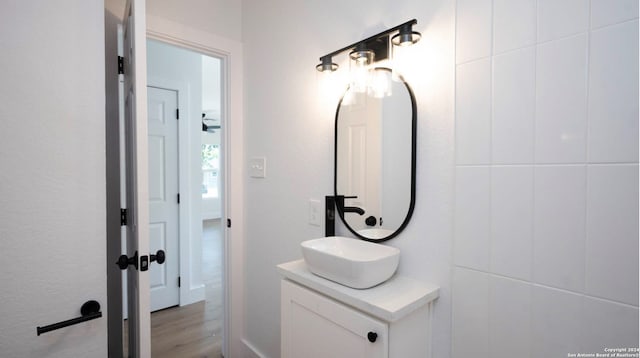 bathroom with vanity and hardwood / wood-style floors