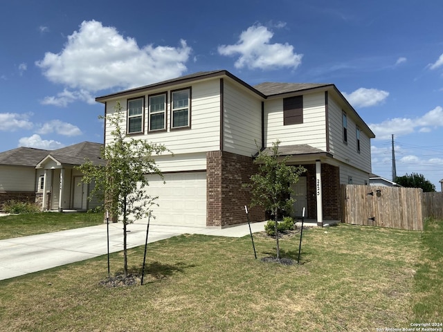 view of front of property featuring a garage and a front yard