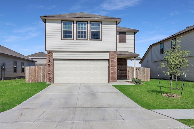 view of front property with a garage and a front lawn