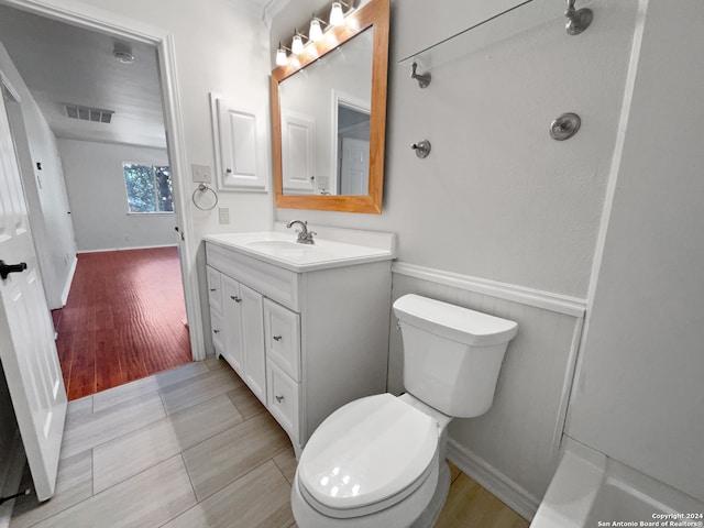 bathroom featuring vanity, toilet, and wood-type flooring