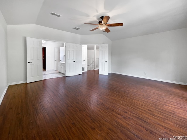 unfurnished living room with dark wood-type flooring, lofted ceiling, and ceiling fan