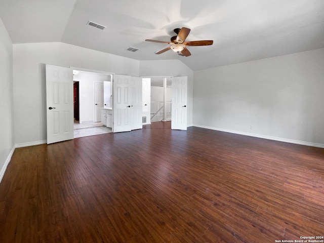 interior space featuring ceiling fan, dark hardwood / wood-style flooring, and vaulted ceiling