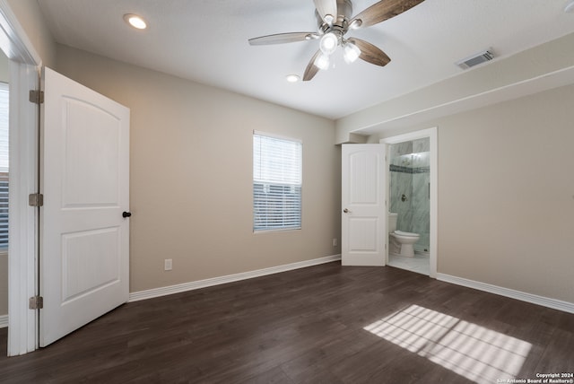 unfurnished bedroom featuring ensuite bathroom, ceiling fan, and wood-type flooring