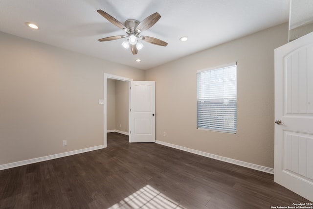 empty room featuring ceiling fan and hardwood / wood-style floors