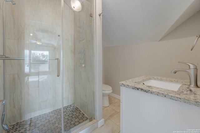 bathroom featuring a shower with shower door, lofted ceiling, tile patterned floors, toilet, and vanity