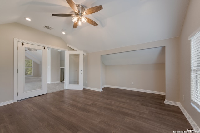 spare room featuring ceiling fan, hardwood / wood-style flooring, and vaulted ceiling