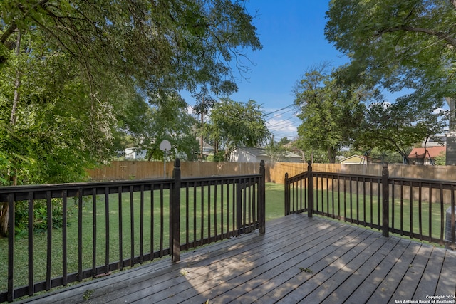 wooden deck with a yard