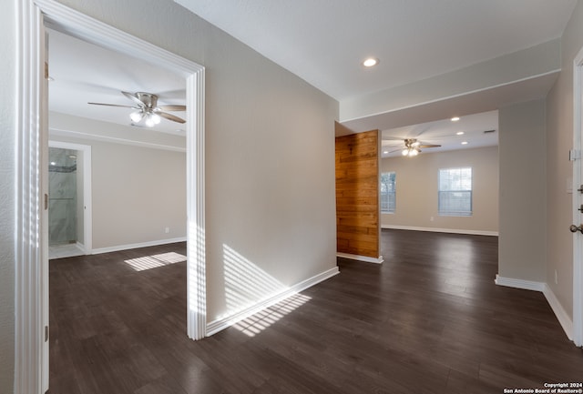 empty room featuring dark hardwood / wood-style floors and ceiling fan