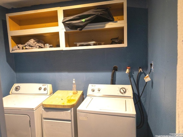 clothes washing area with washing machine and clothes dryer