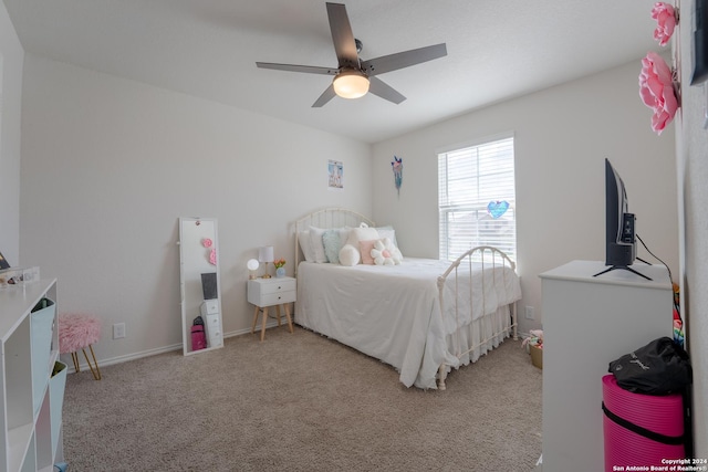 bedroom with ceiling fan and carpet