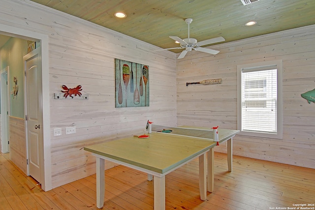 recreation room with wood ceiling, ceiling fan, and light hardwood / wood-style flooring