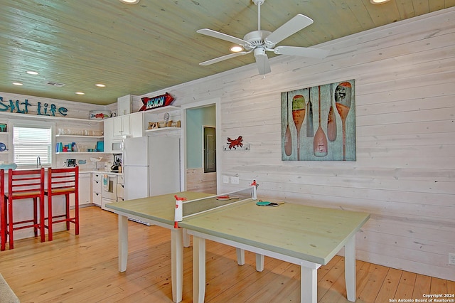 playroom featuring ceiling fan, wood walls, light hardwood / wood-style flooring, and wooden ceiling