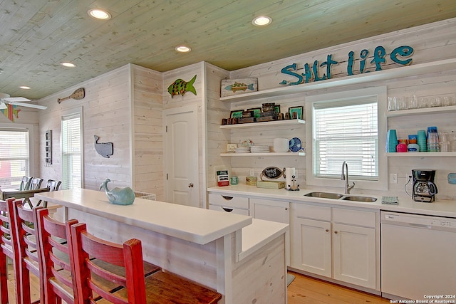 kitchen with light wood-type flooring, white cabinets, dishwasher, wooden ceiling, and sink