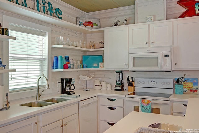 kitchen featuring wooden ceiling, a healthy amount of sunlight, white cabinets, and white appliances