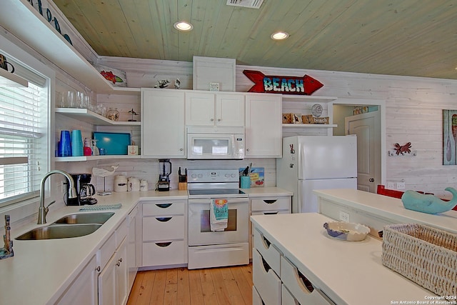 kitchen with white appliances, white cabinets, wood ceiling, sink, and light hardwood / wood-style floors