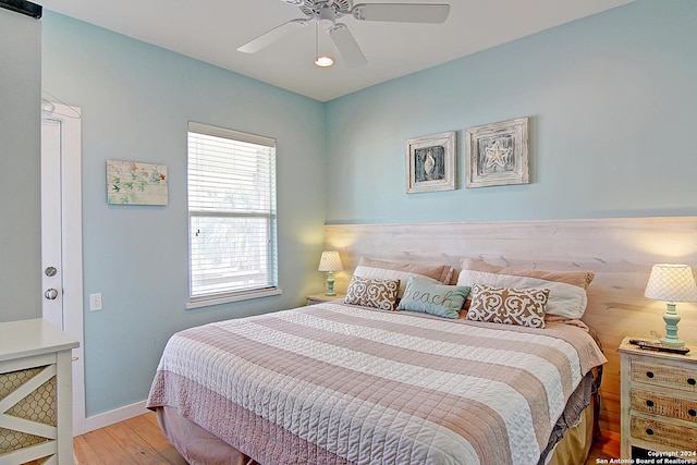 bedroom featuring ceiling fan and hardwood / wood-style flooring