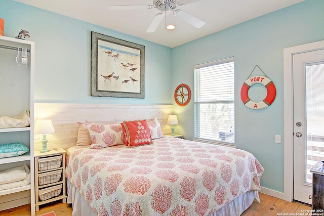 bedroom with light hardwood / wood-style floors and ceiling fan