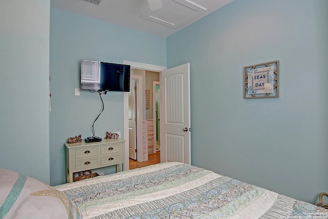 bedroom with ceiling fan and light wood-type flooring