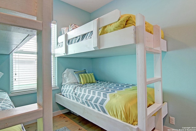 bedroom with hardwood / wood-style floors