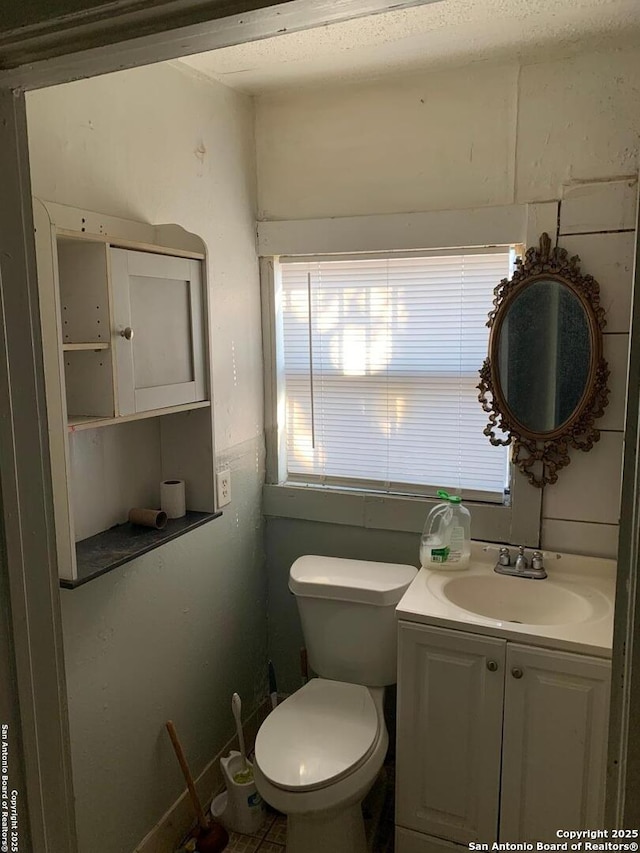 half bath with toilet and vanity