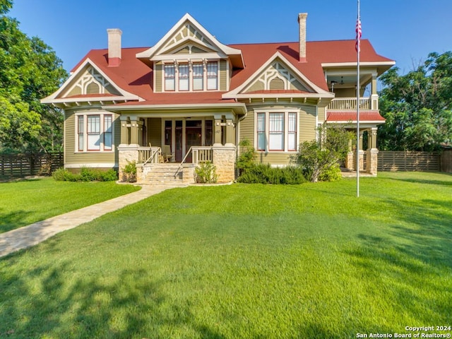 view of front facade with a porch and a front lawn