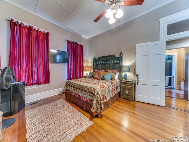 bedroom with hardwood / wood-style floors and ceiling fan