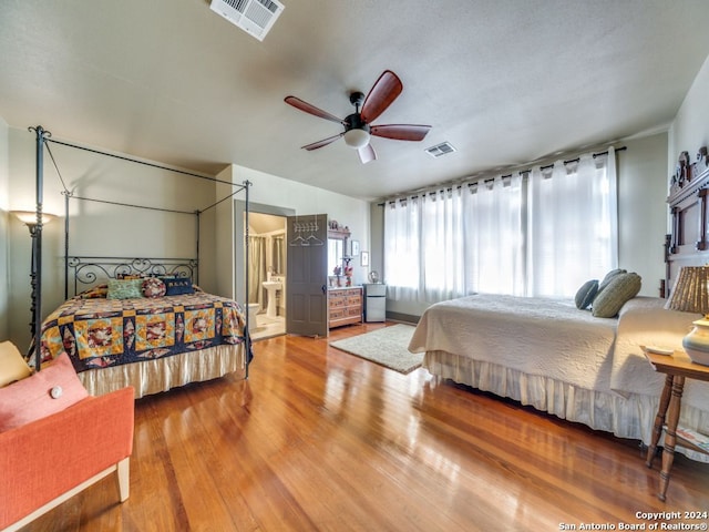 bedroom featuring ceiling fan, wood-type flooring, and connected bathroom