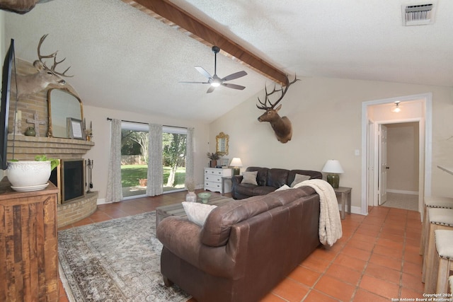 living room featuring tile patterned flooring, vaulted ceiling with beams, a fireplace, and a textured ceiling