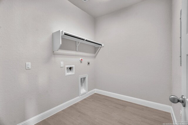 209 Canton Chase, Cibolo, TX 78108 - laundry room featuring gas dryer hookup, hookup for an electric dryer, baseboards, hookup for a washing machine, and wood finished floors