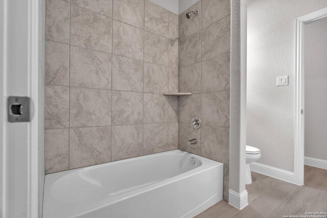 209 Canton Chase, Cibolo, TX 78108 - bathroom with toilet, baseboards, washtub / shower combination, and a textured wall