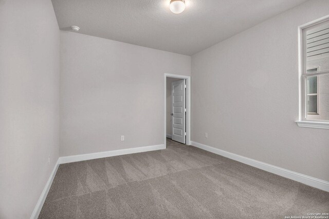 209 Canton Chase, Cibolo, TX 78108 - carpeted empty room with baseboards and a textured ceiling