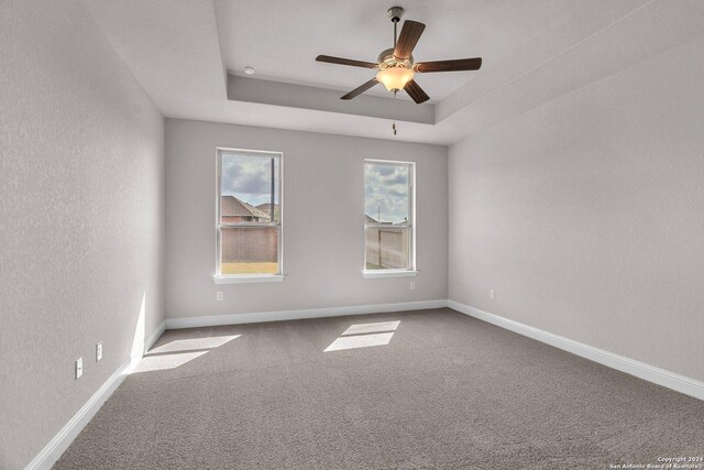 209 Canton Chase, Cibolo, TX 78108 - carpeted spare room with a ceiling fan, baseboards, a textured wall, and a tray ceiling