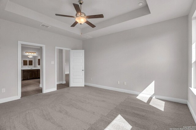 209 Canton Chase, Cibolo, TX 78108 - unfurnished bedroom with carpet, a raised ceiling, connected bathroom, and baseboards