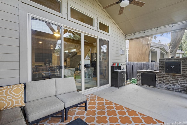 view of patio featuring ceiling fan and fence