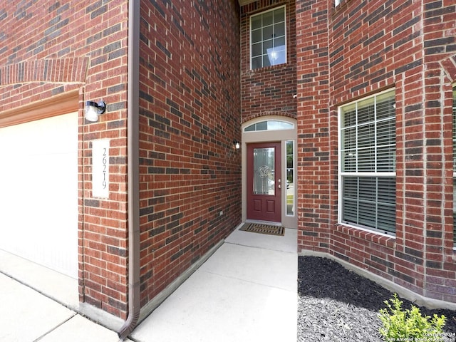 entrance to property featuring a garage