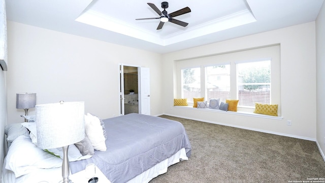 bedroom featuring carpet flooring, ceiling fan, and a raised ceiling