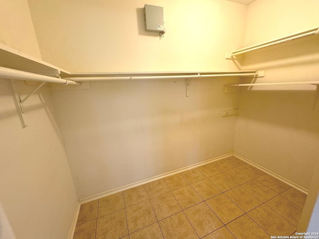 walk in closet featuring tile patterned flooring