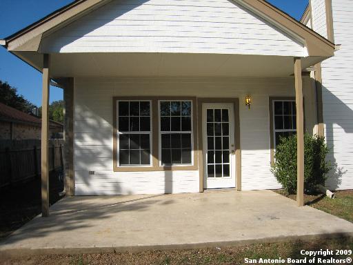 back of property featuring a patio