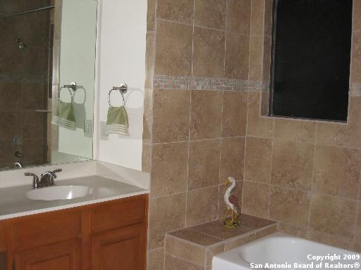 bathroom featuring vanity and separate shower and tub