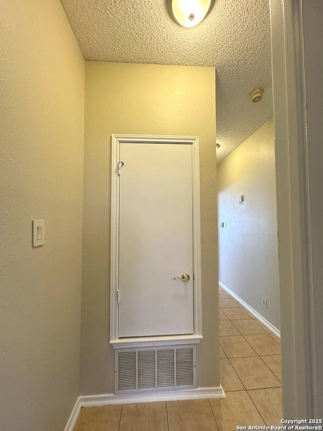 interior space with a textured ceiling