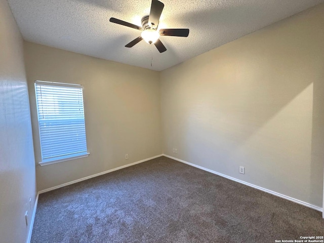 unfurnished room featuring ceiling fan, a textured ceiling, and dark colored carpet