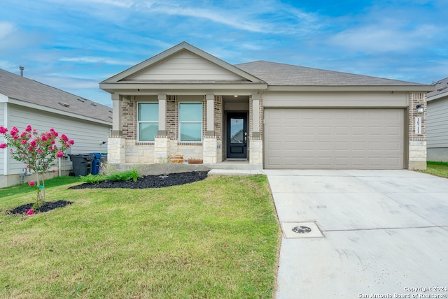 view of front facade with a garage and a front lawn