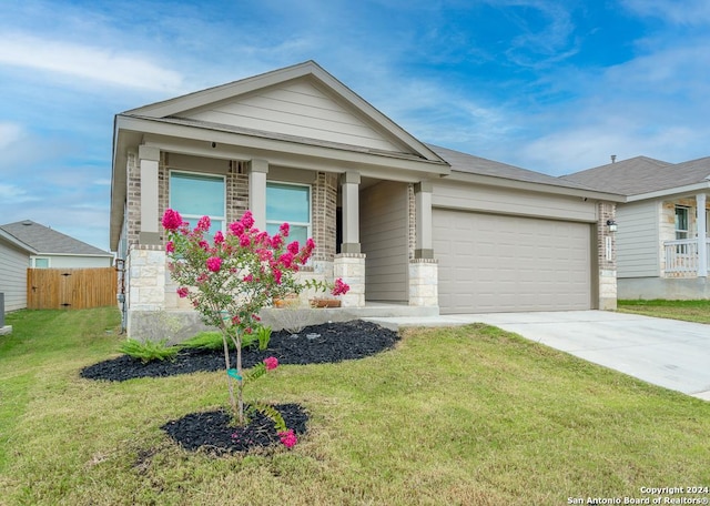 view of front facade featuring an attached garage, fence, concrete driveway, stone siding, and a front lawn