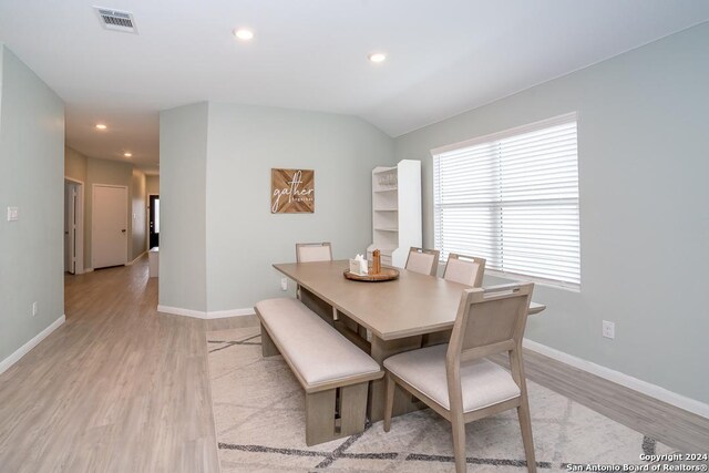 dining area featuring light wood-type flooring and ceiling fan