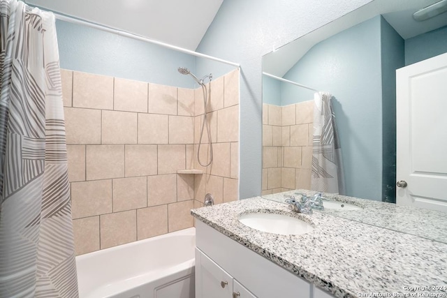 bathroom with shower / bath combo and vanity