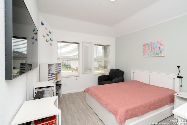 bedroom with baseboards and light wood-style floors